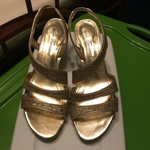 Gold high heel shoes
